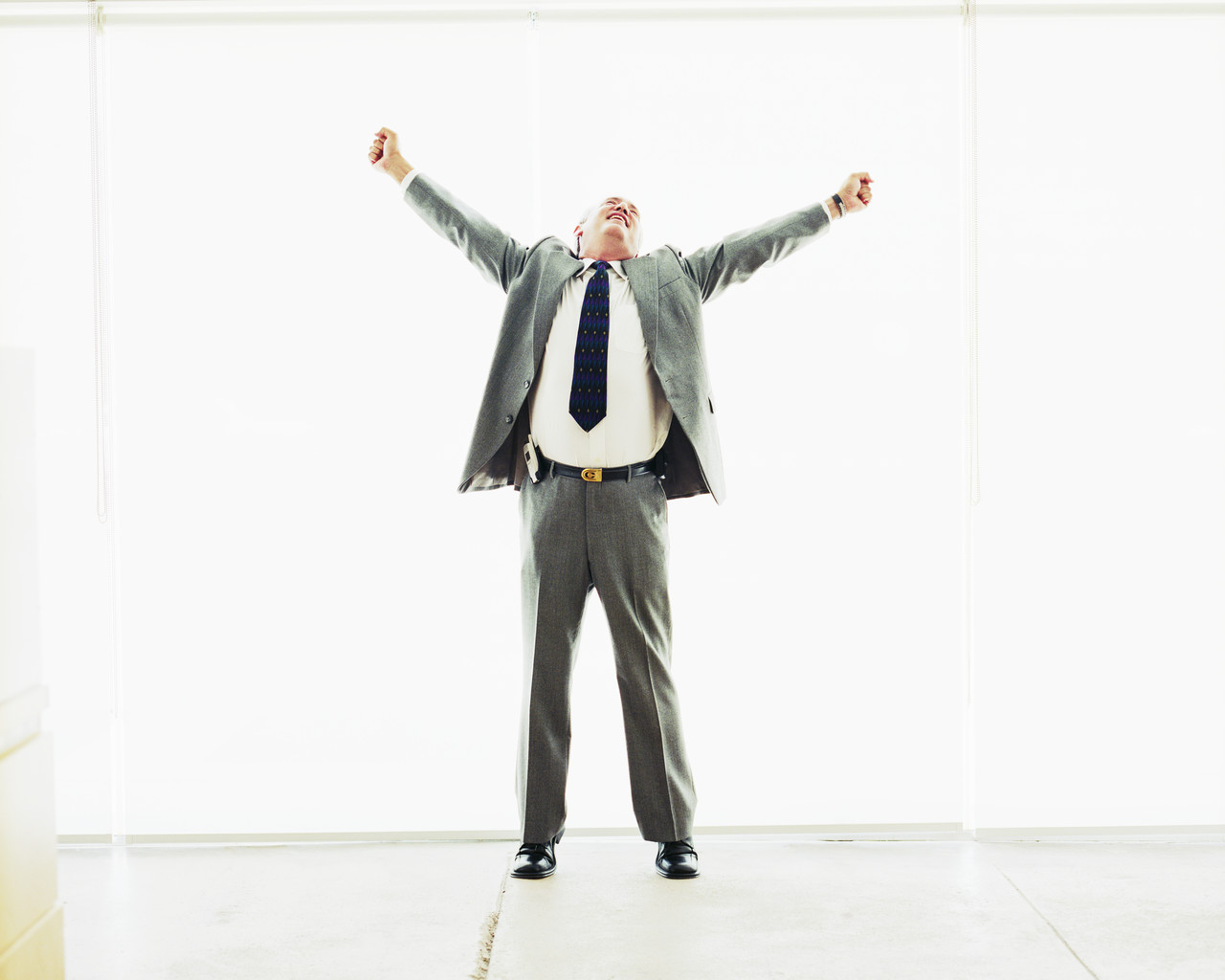 Businessman Stretching Out Arms in Joy Businessman Stretching Out Arms in Joy - Top Corporations That Pay No Taxes